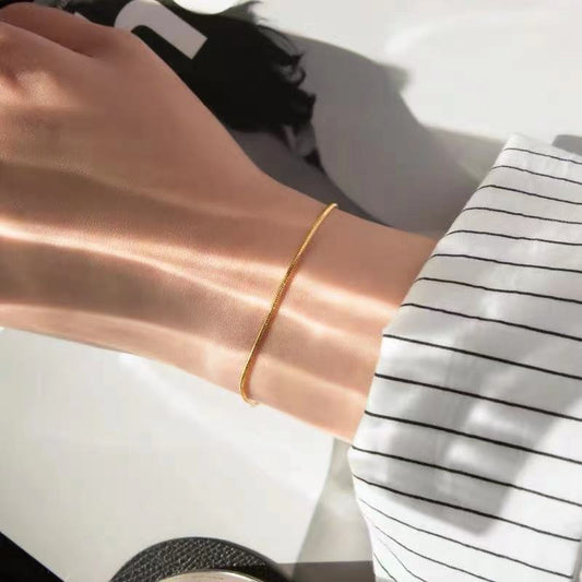 delicate gold snake chain bracelet