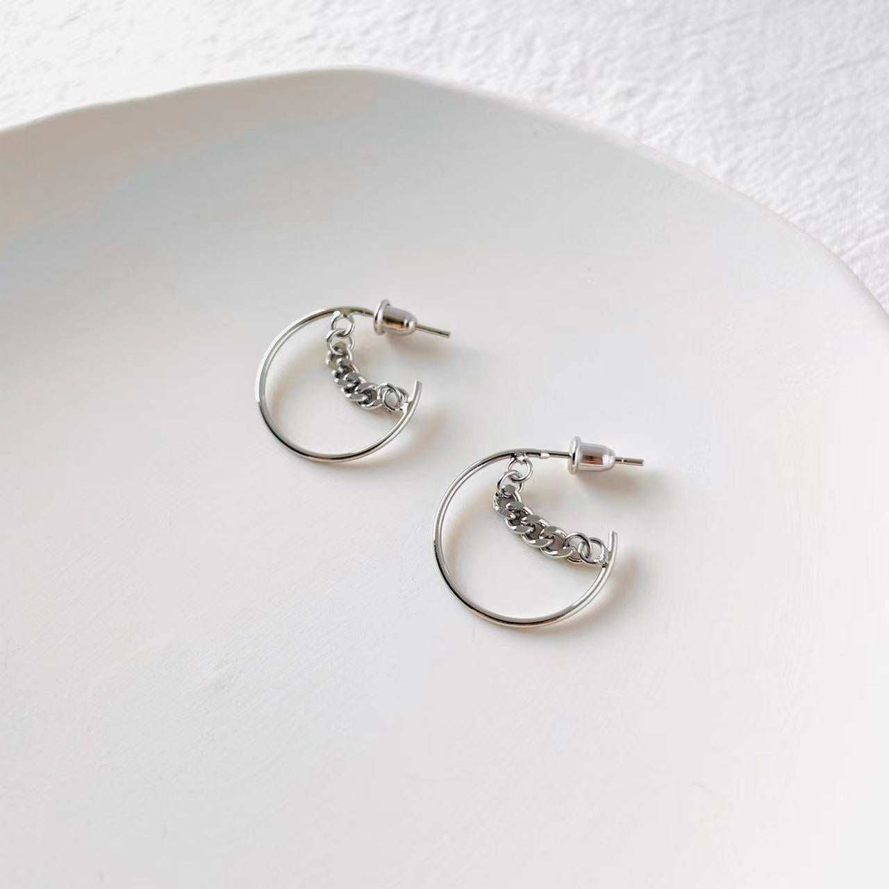 chained silver earrings