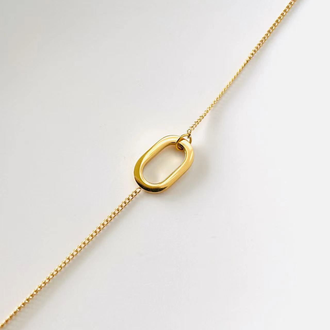 gold geometrical pendant necklace