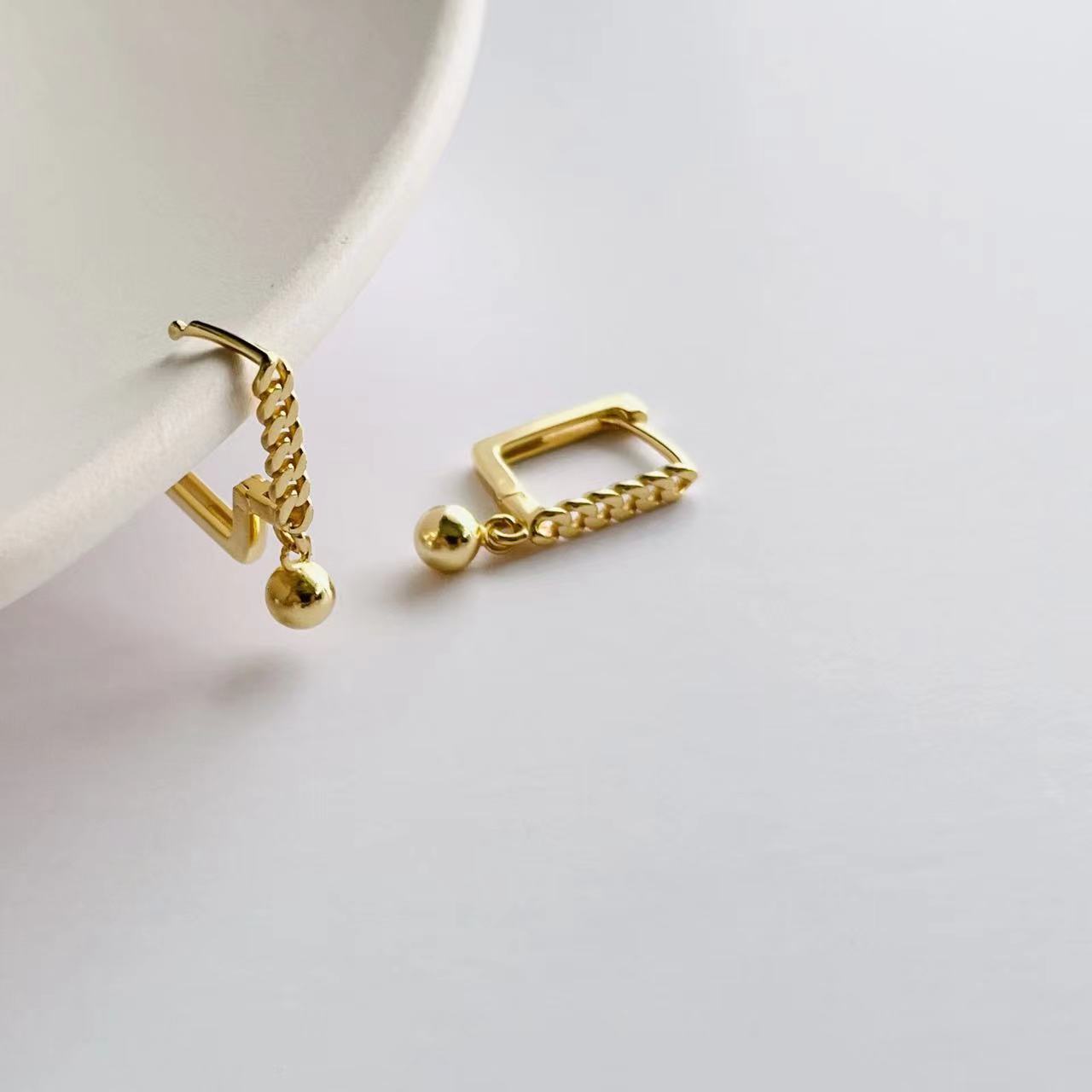 gold chain details earrings